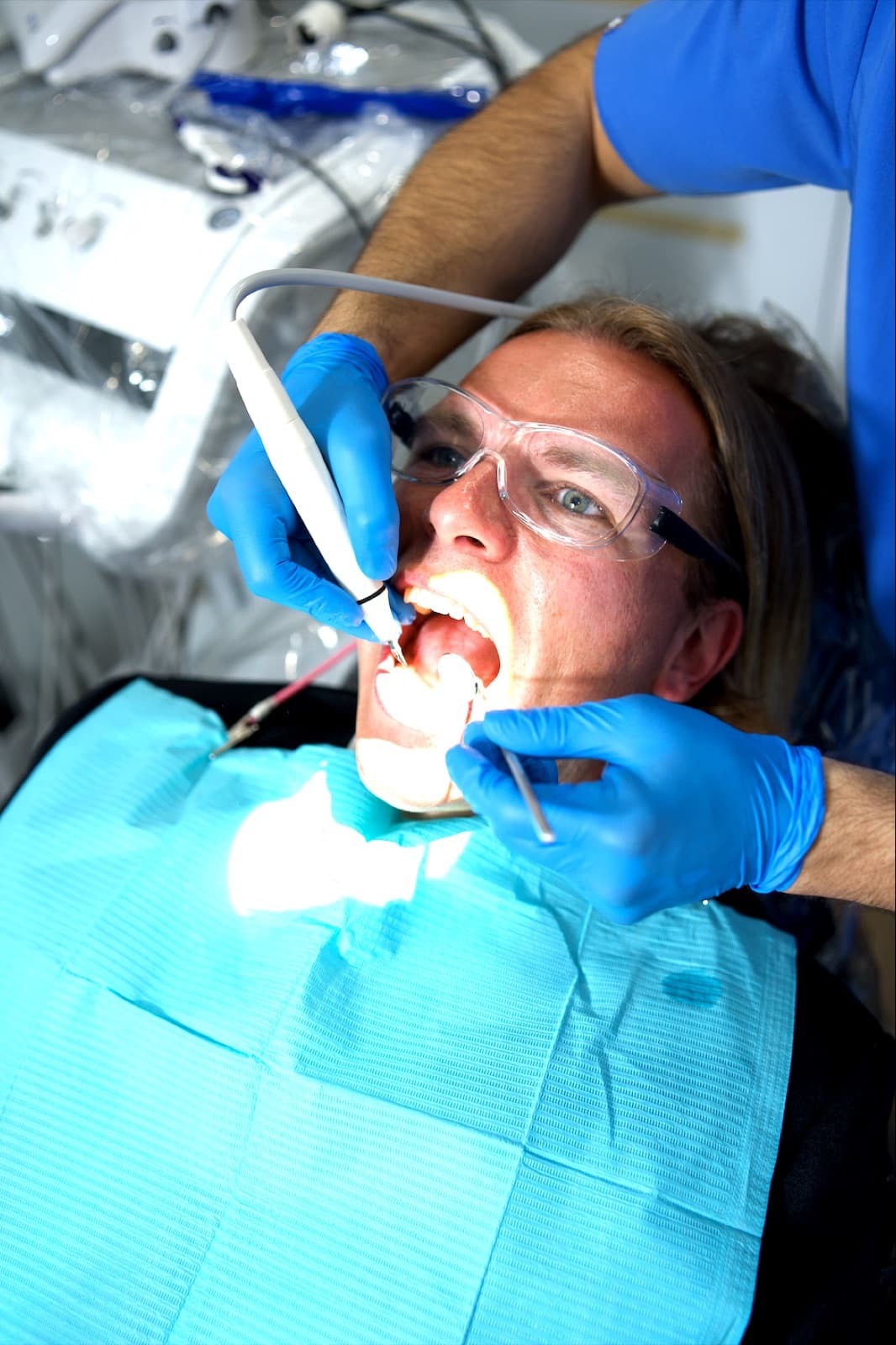 A patient receiving a professional dental cleaning during a mobile dental visit